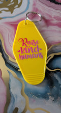 Raise kind humans motel keychain