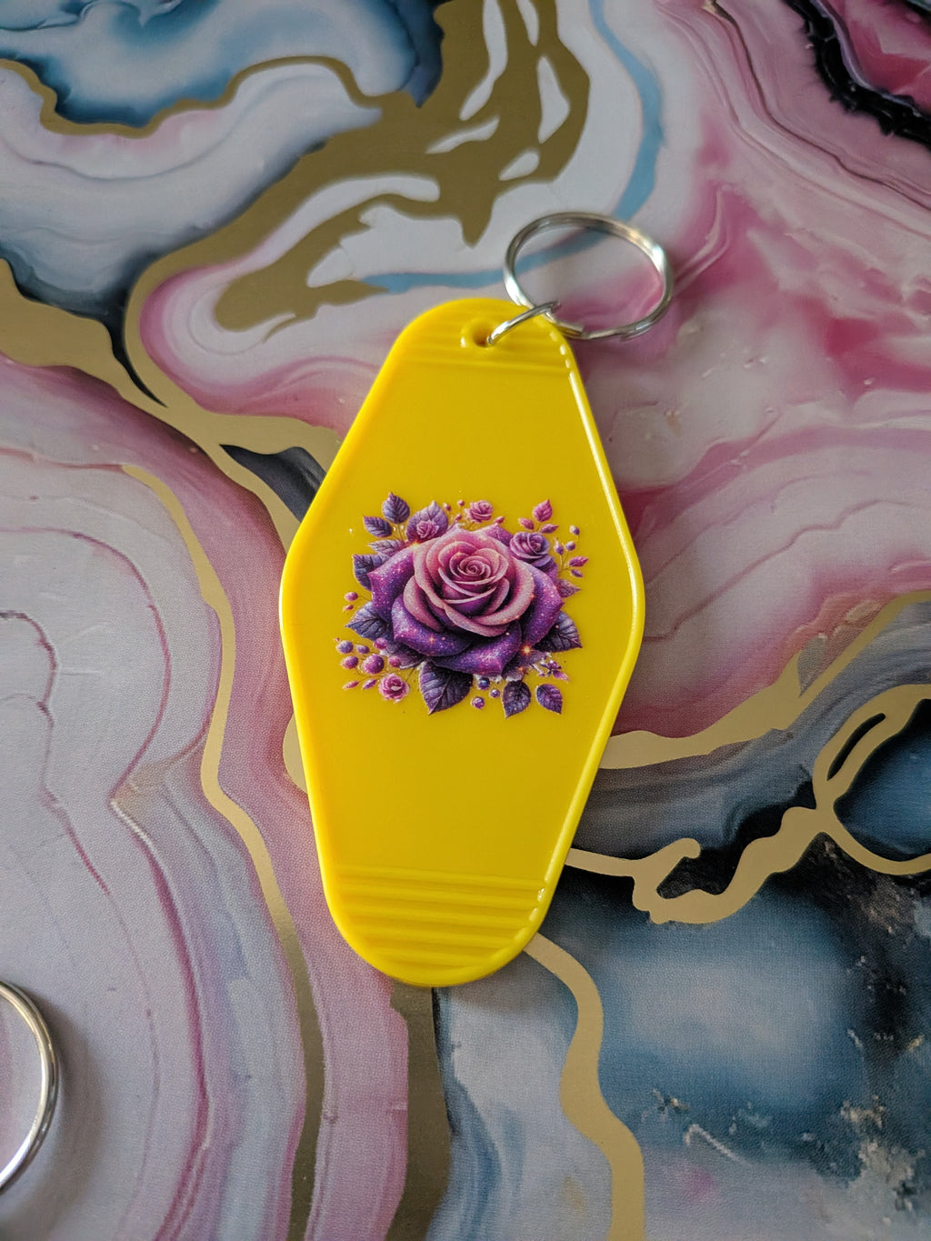 Raise kind humans motel keychain