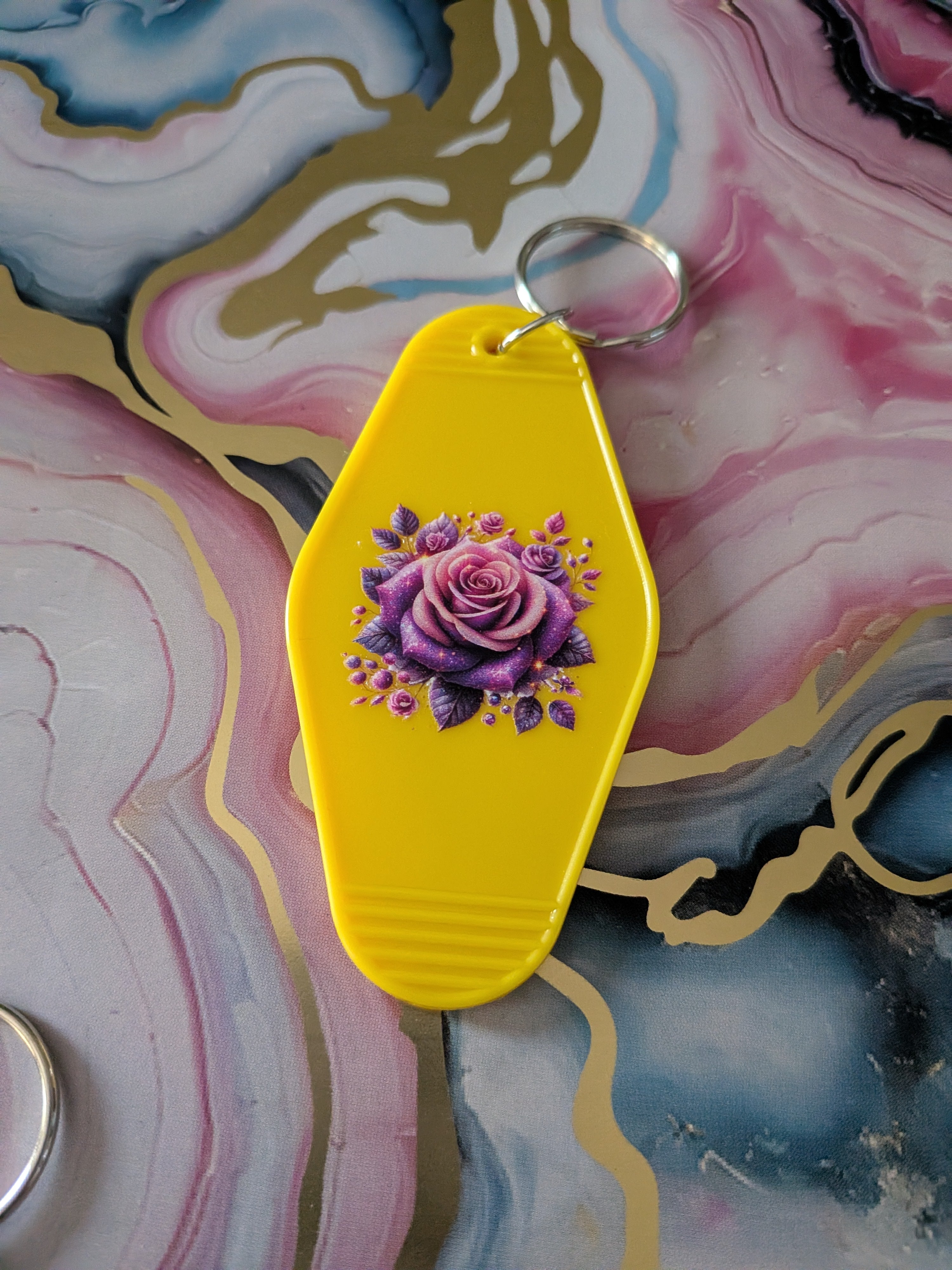 Raise kind humans motel keychain